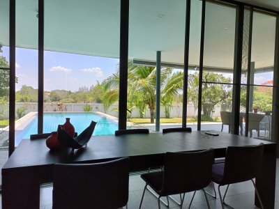 Beautiful pool villa on large land plot near Hua Hin city .