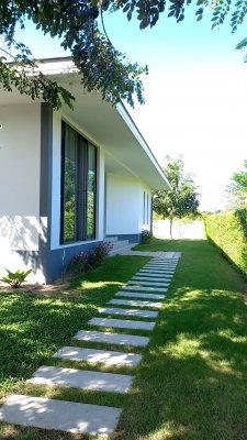 Beautiful pool villa on large land plot near Hua Hin city .