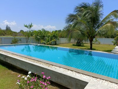 Beautiful pool villa on large land plot near Hua Hin city .