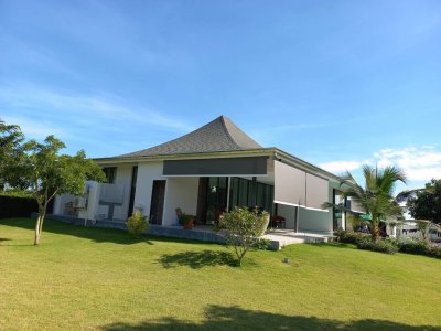 Beautiful pool villa on large land plot near Hua Hin city .